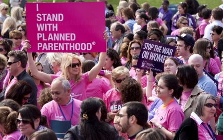 Members of Planned Parenthood, NARAL Pro-Choice America and more than 20 other organizations hold a