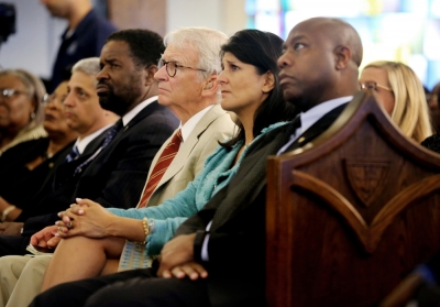 U.S. Senator Tim Scott, S.C. Governor Nikki Haley and Charleston Mayor Joe Riley, (R-L) attend a prayer vigil held at Morris Brown AME Church in Charleston, South Carolina, June 18, 2015. A white man suspected of killing nine people in a Bible-study group at a historic African-American church in Charleston, South Carolina was arrested on Thursday and U.S. officials are investigating the attack as a hate crime.