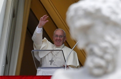 Pope Francis waves as he leads the Angelus prayer from the window of the Apostolic palace in Saint Peter's Square at the Vatican, August 2, 2015.