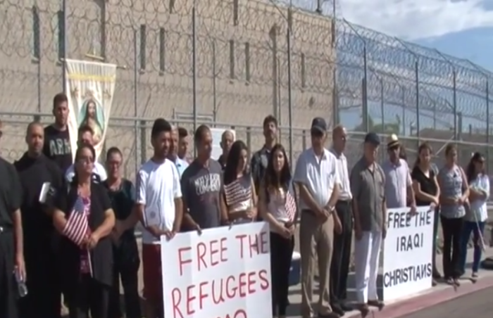 A group of San Diego area Chaldean Christians hold a prayer service outside of an immigration detention center in Otay on behalf of 20 Iraqi detainees within the facility on Thursday, July 30, 2015.