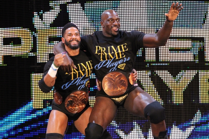 WWE Wrestler poses with fellow Tag Team Champion Darren Young on Monday Night Raw.