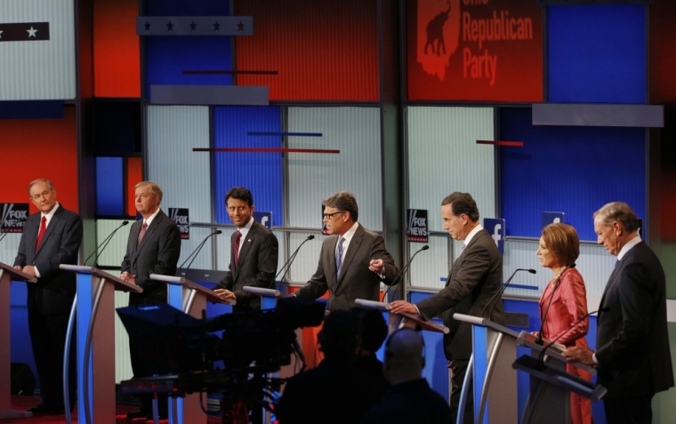Republican presidential candidates (L-R), former Virginia Governor Jim Gilmore, U.S. Senator Lindsey Graham, Louisiana Governor Bobby Jindal, former Texas Governor Rick Perry, former U.S. Senator Rick Santorum, former HP CEO Carly Fiorina and former New York Governor George Pataki, debate at a Fox-sponsored forum for lower polling candidates held before the first official Republican presidential candidates debate of the 2016 U.S. presidential campaign in Cleveland, Ohio, August 6, 2015.