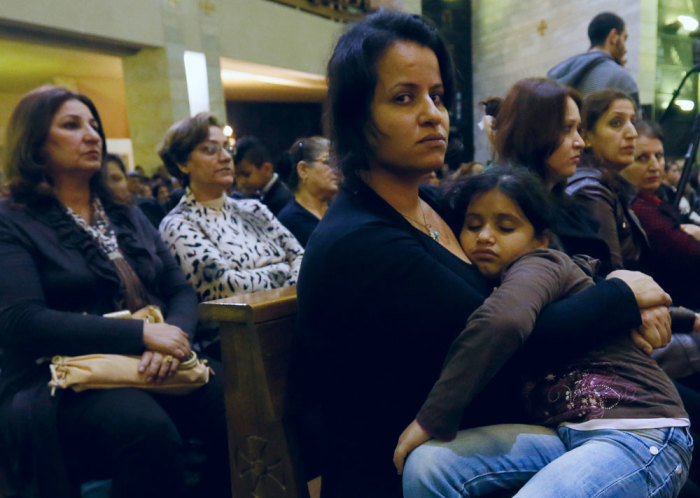 Iraqi Christian refugees attend a service at a church in Hazmiyeh, near Beirut December 12, 2014. Iraqi Christians who sought refuge in Lebanon after Islamist militants tore through their homeland said they had no idea when they would be able to return as they gathered for prayers ahead of Christmas. Picture taken December 12, 2014.