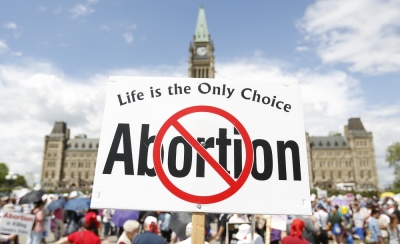 Anti-abortion protesters take part in the National March for Life on Parliament Hill in Ottawa, May 9, 2013.