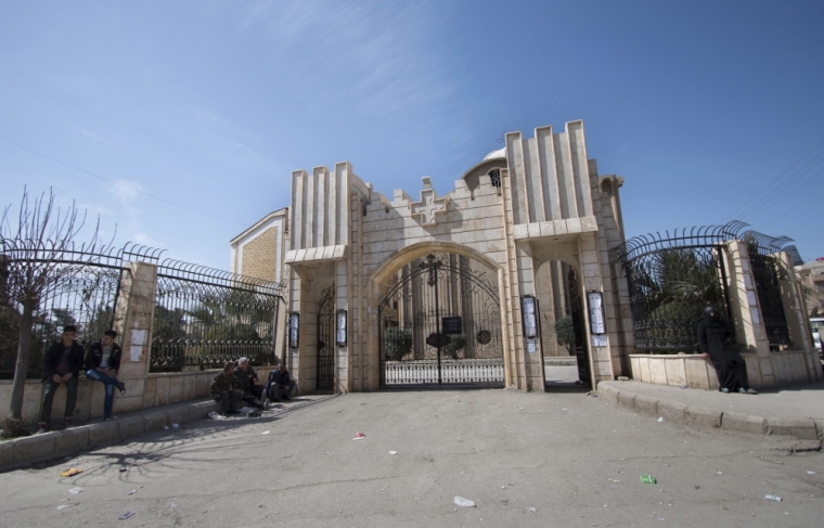 Displaced Assyrians, who fled from the villages around Tel Tamr, gather outside the Assyrian Church in al-Hasaka city, as they wait for news about the Assyrians abductees remaining in Islamic State hands, March 9, 2015. Islamic State released 19 Assyrian Christian captives in Syria on March 1 after processing them through a sharia court, a monitoring group which tracks the conflict said. More than 200 Assyrians remain in Islamic State hands, said the British-based Syrian Observatory for Human Rights.