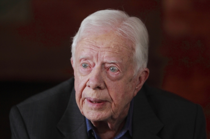 Former U.S. President Jimmy Carter speaks during an interview with Reuters in Kathmandu April 1, 2013. The former president, whose Carter Center observed Nepal's last elections in 2008, arrived last week to encourage political parties to conduct delayed national elections and to push forward a peace process following the war. Carter said his organisation would again observe the polls expected this year.
