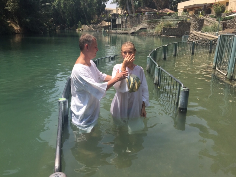 Former 'Real Housewives of Miami' star Joanna Krupa is seen here being baptized in the Jordan River in Israel on August 7, 2015.