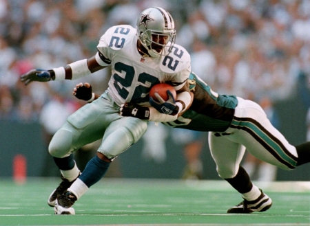 Cornerback Deion Sanders of the Dallas Cowboys prays while standing