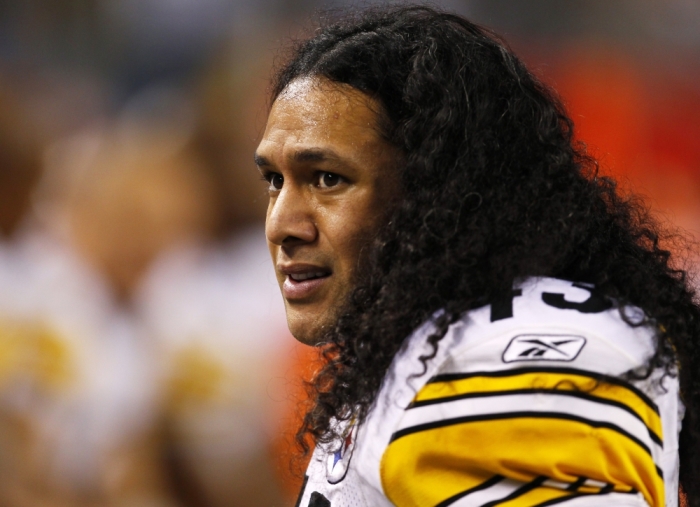 Pittsburgh Steelers safety Troy Polamalu watches from the sidelines during the first half against the Green Bay Packers in the NFL's Super Bowl XLV football game in Arlington, Texas, February 6, 2011.