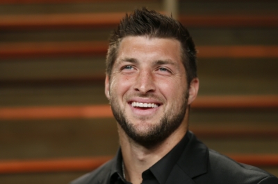 Former NFL player Tim Tebow arrives at the 2014 Vanity Fair Oscars Party in West Hollywood, California, March 2, 2014.