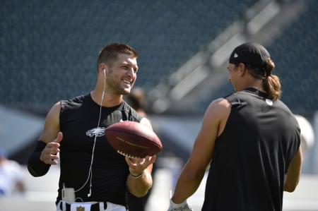 Philadelphia Eagles quarterback Tim Tebow (L) talks to wide receiver Riley Cooper (R) prior to their preseason NFL football game against the Indianapolis Colts at Lincoln Financial Field, Philadelphia, Pennsylvania, August 16, 2015.