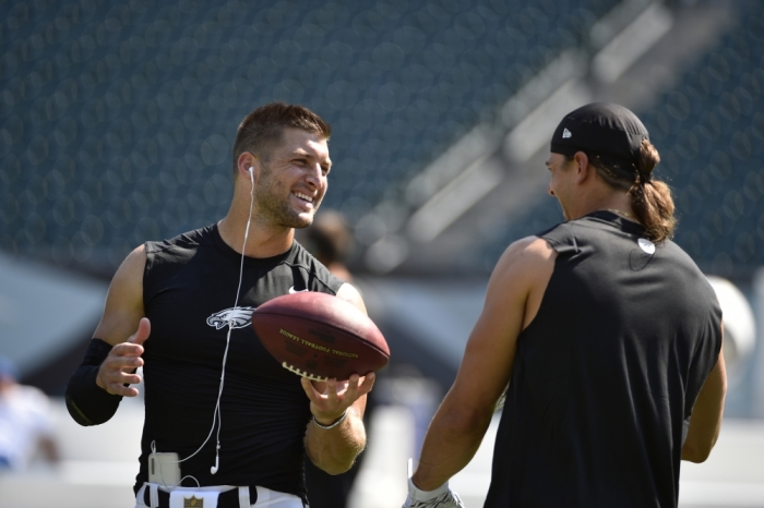 Philadelphia Eagles quarterback Tim Tebow (L) talks to wide receiver Riley Cooper (R) prior to their preseason NFL football game against the Indianapolis Colts at Lincoln Financial Field, Philadelphia, Pennsylvania, August 16, 2015.