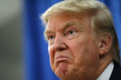 U.S. Republican presidential candidate Donald Trump answers a question at a news conference before a campaign rally in Hampton, New Hampshire August 14, 2015.