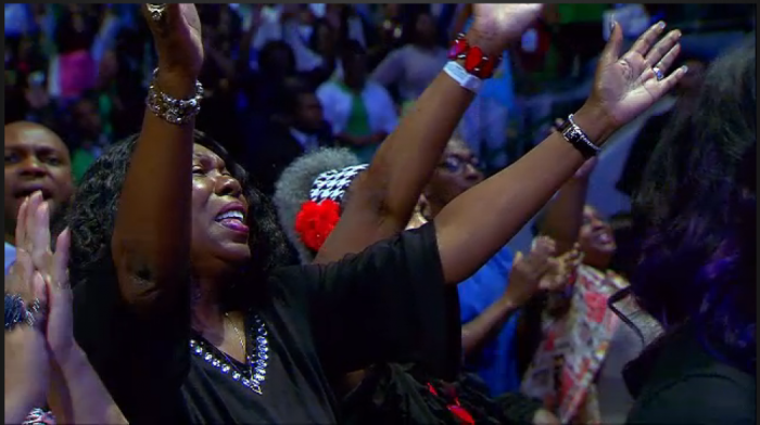 People praising and worshipping at MegaFest at American Airlines Center in Dallas, Texas on August 23, 2015.