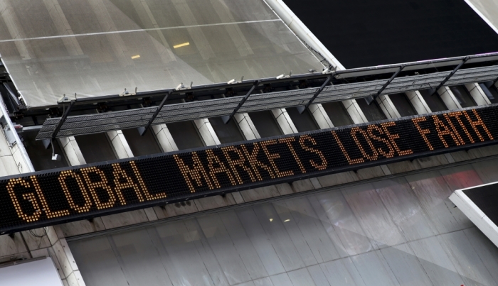 A headline about the global sell-off in stocks is displayed on the Times Square 'Zipper' in New York, August 24, 2015. Wall Street opened sharply lower on Monday with the Dow Jones industrial average losing more than a 1,000 points following a more-than 8 percent drop in Chinese shares and a selloff in oil and other commodities.