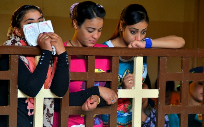Christians attend Sunday service in the Virgin Mary Church at Samalout Diocese in Al-Our village, in Minya governorate, south of Cairo, May 3, 2015. Copts have long complained of discrimination under successive Egyptian leaders and Sisi's actions suggested he would deliver on promises of being an inclusive president who could unite the country after years of political turmoil. However, striking out at extremists abroad might prove easier than reining in radicals at home. Orthodox Copts, the Middle East's biggest Christian community, are a test of Sisi's commitment to tolerance, a theme he often stresses in calling for an ideological assault on Islamist militants threatening Egypt's security.
