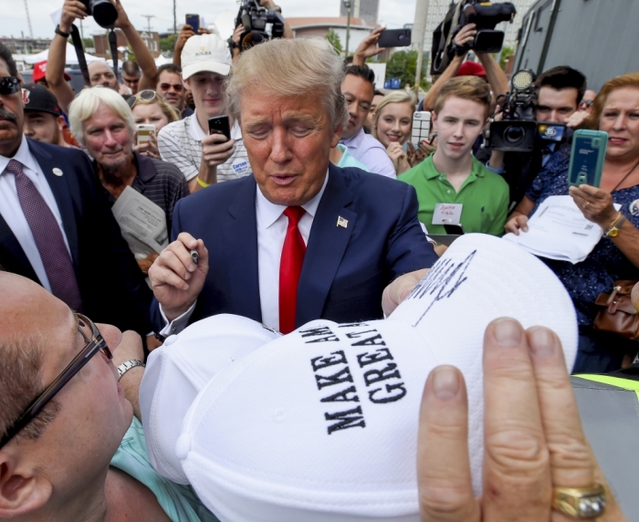 Republican presidential candidate Donald Trump signs autographs during the National Federation of Republican Assemblies at Rocketown in Nashville, Tennessee August 29, 2015.