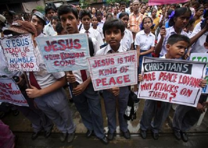 School children listen to a speech by a Christian leader during a protest rally in the eastern Indian city of Kolkata August 29, 2008.