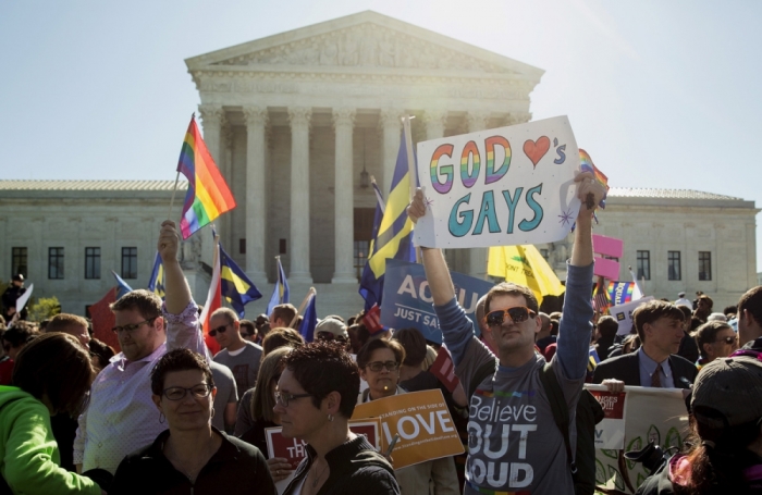 Same-sex marriage supporters rally in front of the U.S. Supreme Court in this April 28, 2015, file photo.