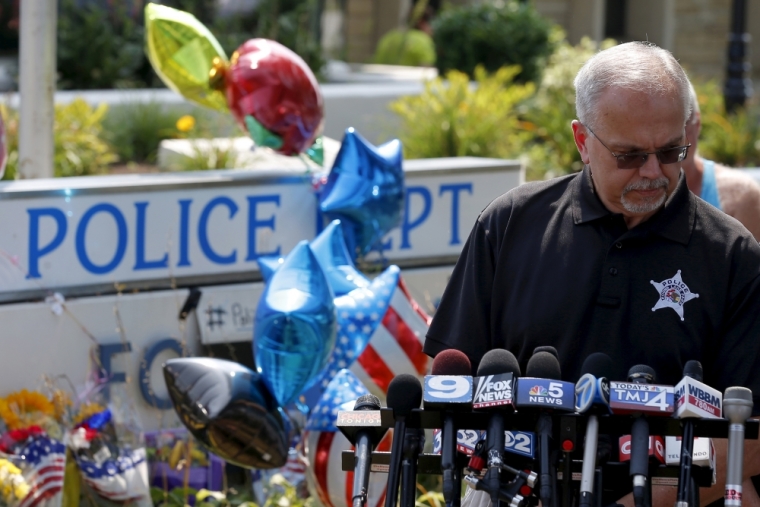 George Filenko of the Lake County Major Crimes Task Force holds a news conference at a vigil for slain Fox Lake Police Lieutenant Charles Joseph Gliniewicz in Fox Lake, Illinois, United States, September 2, 2015. Authorities in northern Illinois expanded their search for three suspects in the fatal shooting of a 30-year police officer as local schools were closed on Wednesday and vigils for the officer were planned.