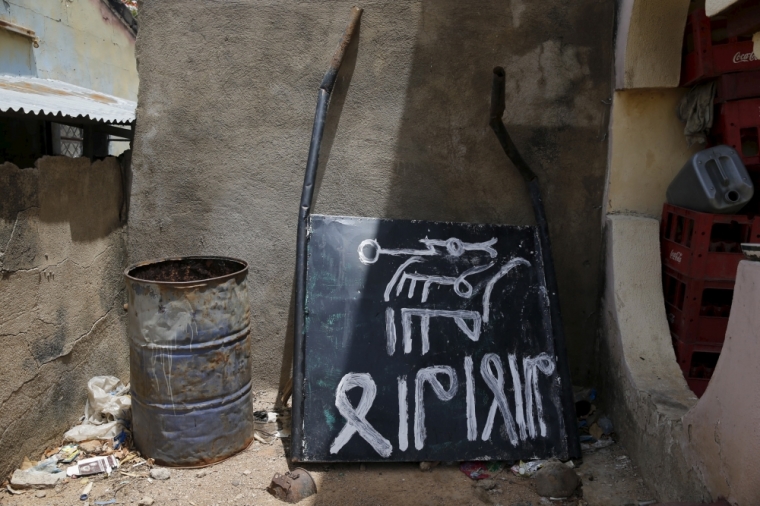 A signboard rests against a wall in a compound in Michika town, after the Nigerian military recaptured it from Boko Haram, in Adamawa state May 10, 2015.