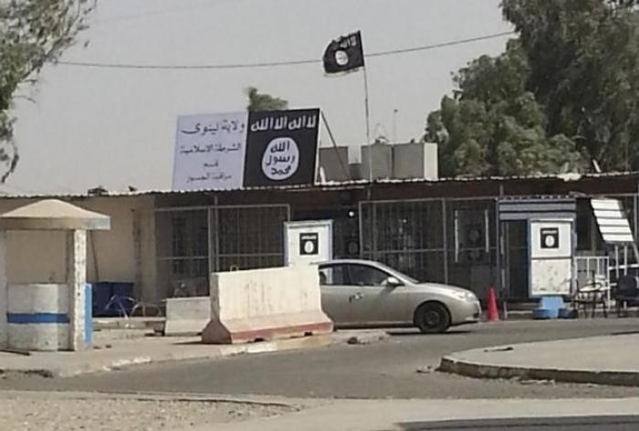 Signs by the Islamic State seen in the city of Mosul, Iraq, July 21, 2014.