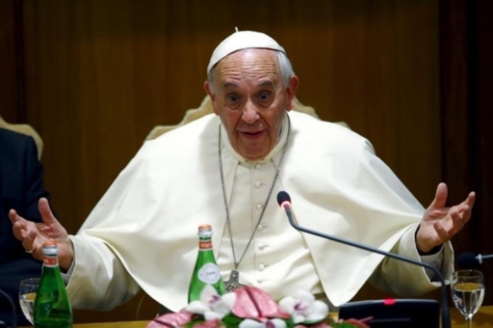 Pope Francis gestures as he speaks during the 'Modern Slavery and Climate Change' conference at the Vatican July 21, 2015.