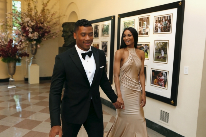 Seattle Seahawks' Russell Wilson and Ciara Harris arrive at a State Dinner in honor of Japanese Prime Minister Shinzo Abe at the White House in Washington, April 28, 2015.