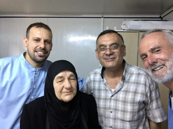 New York City pastor William Devin is seen with new friends in the Syrian border town of Reyhanli, Turkey. Devlin has been volunteering at a clinic aiding refugees fleeing war-torn Syria. This photo was shared with The Christian Post on Sept. 6, 2015.