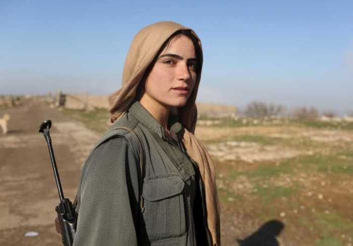 Kurdish woman battles the Islamic State in this undated photo.
