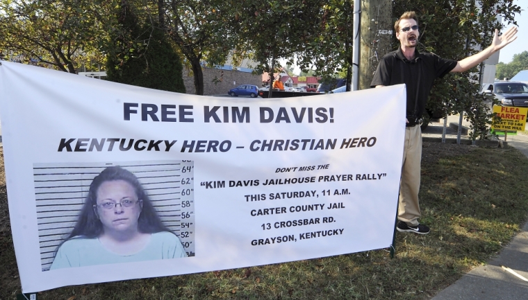 David Jordan, a member of Chirst Fellowship in North Carolina, preaches in support of the prayer rally at the Carter County Detention Center for Rowan County clerk Kim Davis, who remains in contempt of court for her refusal to issue marriage certificates to same-sex couples, in Grayson, Kentucky, September 5, 2015.