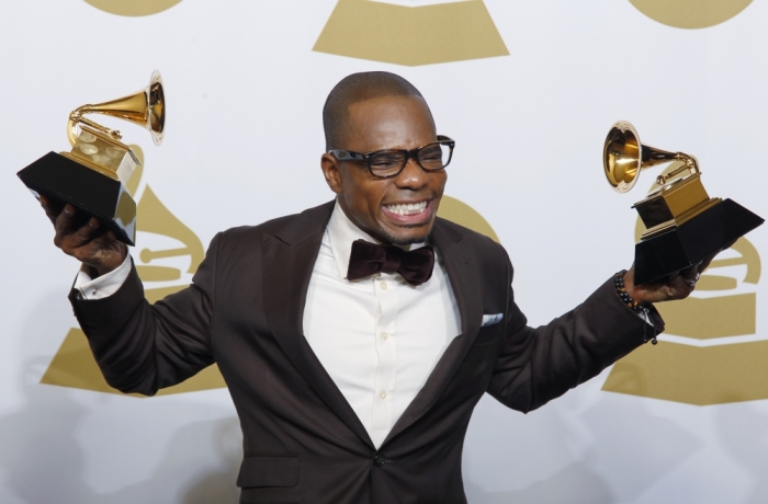 Singer Kirk Franklin holds his awards for 'Best Gospel Album' and Best Gospel Song 'Hello Fear' at the 54th annual Grammy awards in Los Angeles, California, February 12, 2012.