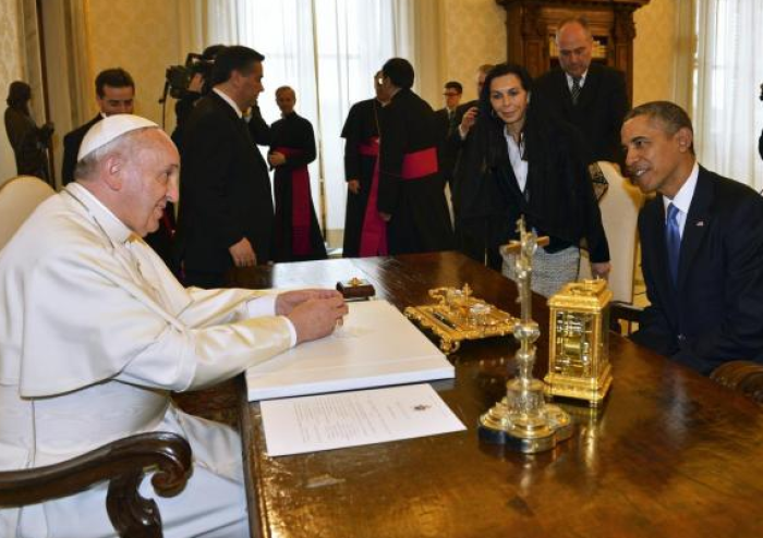 U.S. President Barack Obama talks with Pope Francis during a private audience at the Vatican March 27, 2014.