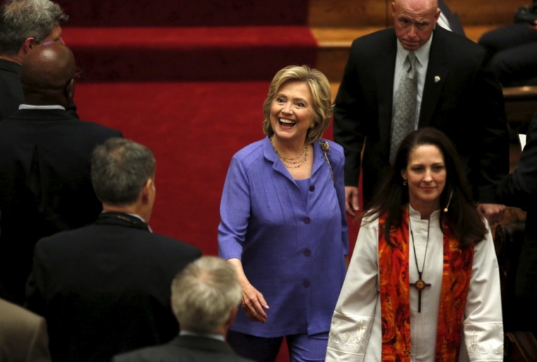 U.S. Democratic presidential candidate Hillary Clinton smiles as she leaves after the Foundry United Methodist Church's bicentennial service in Washington, September 13, 2015.