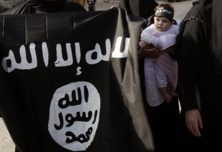Palestinians take part in a protest calling for the release of what they say are jailed Salafist relatives from Hamas prisons, in Rafah in the southern Gaza Strip April 6, 2013. The flag reads, "There is no God but Allah, Mohammed is the messenger of Allah."