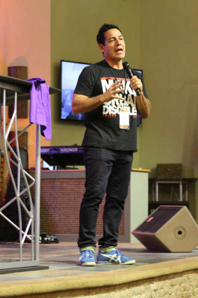 Larry Acosta, founder/chief executive officer of Urban Youth Workers Institute, addresses an audience on September 12, 2015, during his organization's RELOAD event at Bay Ridge Christian Center in Brooklyn, New York.