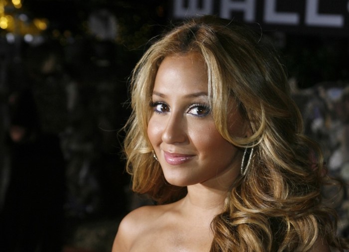 Adrienne Bailon, one of the members of the pop music group 'The Cheetah Girls', poses as she arrives for the world premiere of the animated film 'Wall-E'in Los Angeles, California, June 21, 2008.