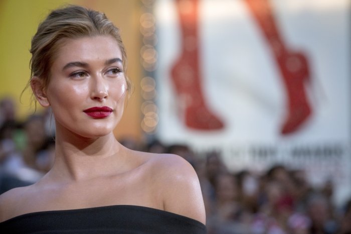 Model Hailey Baldwin poses on the red carpet for a screening of the film “Mission Impossible: Rogue Nation” in New York on July 27, 2015.