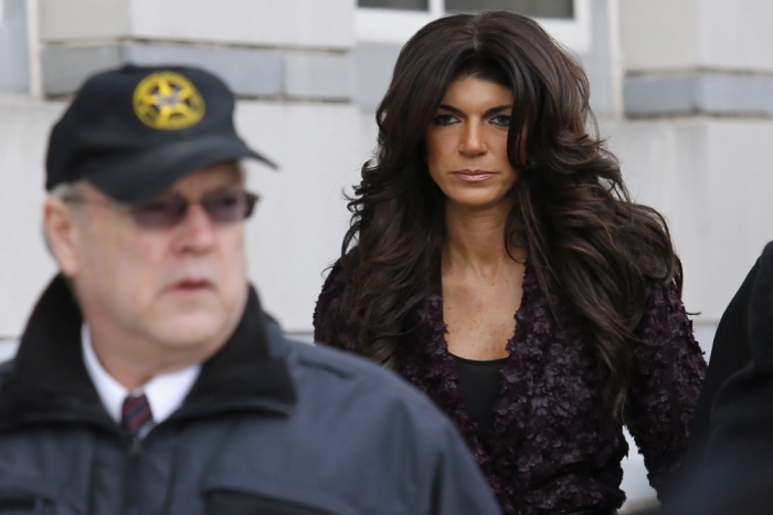 Teresa Giudice (R) exits the Federal Court in Newark, New Jersey, March 4, 2014.