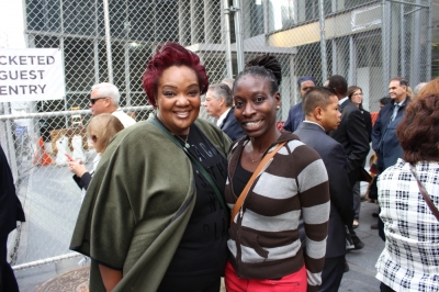 Danielle Henry (l) and her friend Chinyelu Udoh wait to enter the 9/11 Memorial and Museum of an interfaith service with Pope Francis on September 25, 2015.