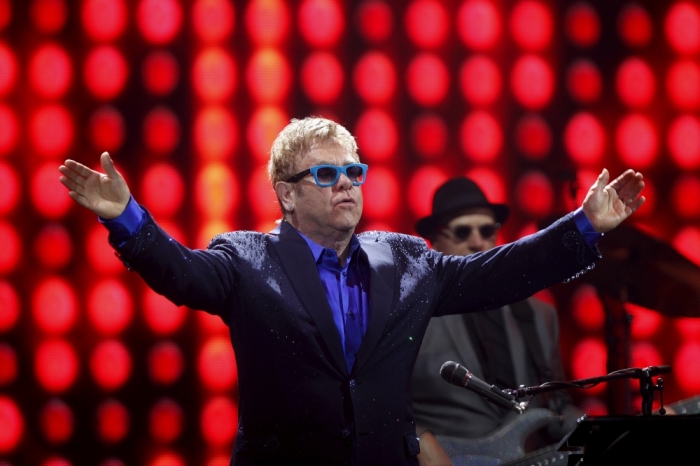 British singer-songwriter Elton John performs with his band during a concert in Malaga, southern Spain, July 15, 2015.