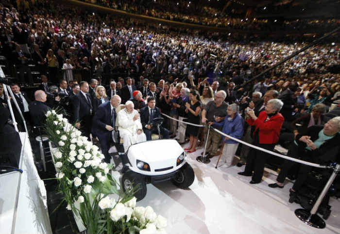 Pope Francis is driven on a golf cart as he arrives at Madison Square Garden to celebrate mass in New York City, September 25, 2015.