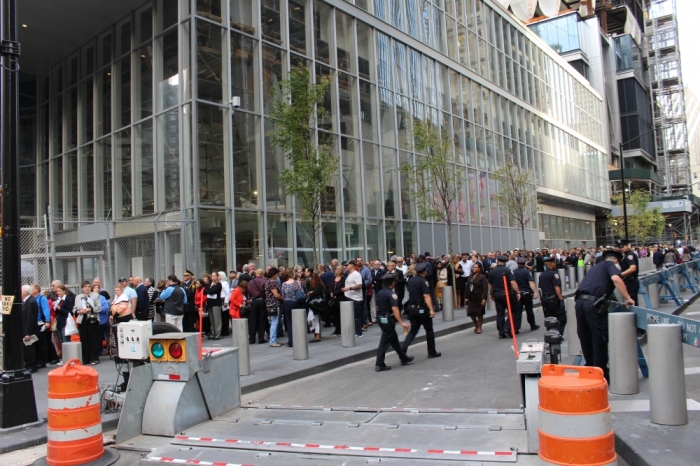 A diverse group of families of victims of the September 11 terrorist attack and other invited guests from the faith community wait to enter the 9/11 Memorial and Museum in Lower Manhattan, New York for an interfaith service with Pope Francis on September 25, 2015.