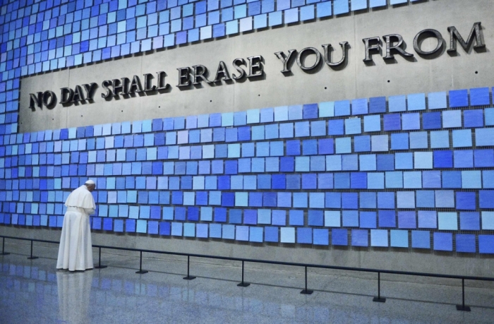 Pope Francis visits the 9/11 Memorial & Museum in New York, and prays at 'Trying to Remember the Color of the Sky on That September Morning' by Spencer Finch. Reposed behind this blue wall are the remains of many who perished at the World Trade Center site on September 11, 2001.