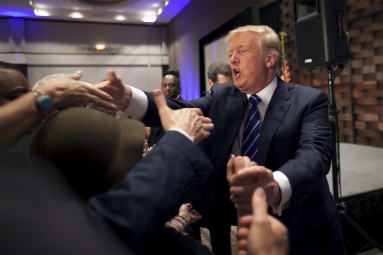 U.S. Republican presidential candidate Donald Trump greets supporters after an address at an event organised by the Greater Charleston Business Alliance and the South Carolina African American Chamber of Commerce in North Charleston, South Carolina, September 23, 2015.