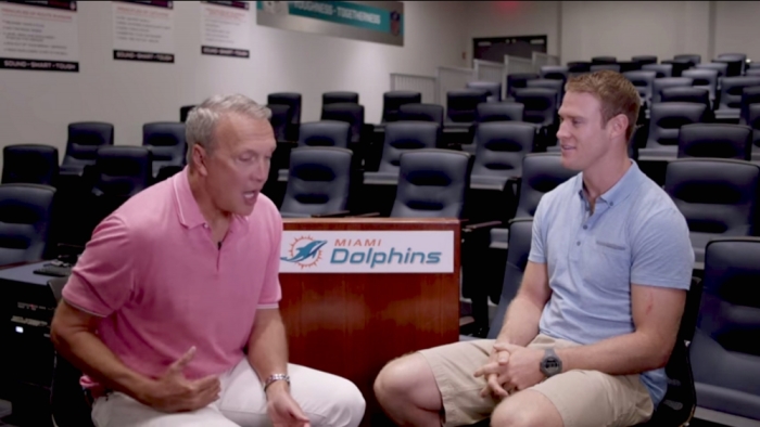Pastor Ed Young in conversation with Miami Dolphins quarterback Ryan Tannehill.