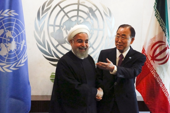 U.N. Secretary-General Ban Ki-moon (R) gestures as he poses for a photograph with Iran's President Hassan Rouhani during their meeting ahead of the United Nations General Assembly at the United Nations Headquarters in New York, September 26, 2015.