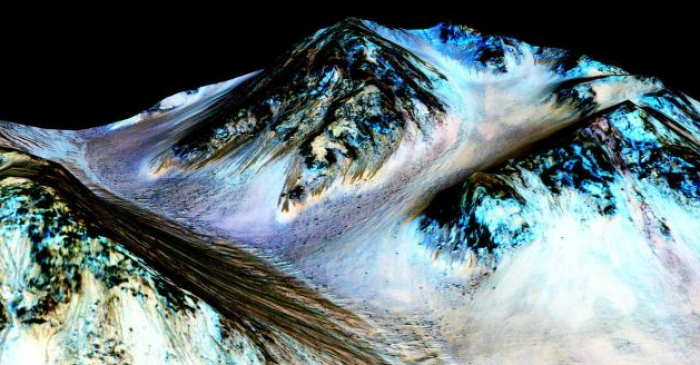 Dark, narrow, 100 meter-long streaks on Mars inferred to have been formed by contemporary flowing water are seen in an image produced by NASA, the Jet Propulsion Laboratory and the University of Arizona.