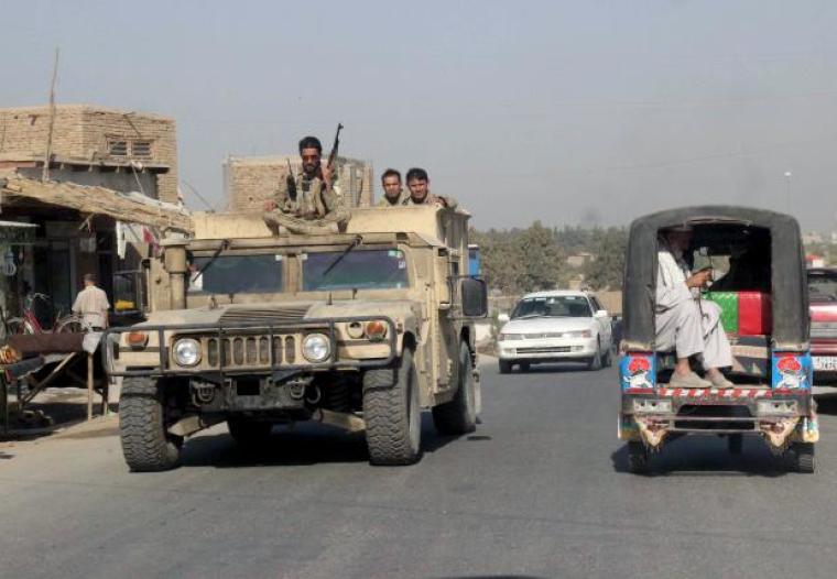 Afghan security forces travel on an armored vehicle in Kunduz Province, Afghanistan September 28, 2015.