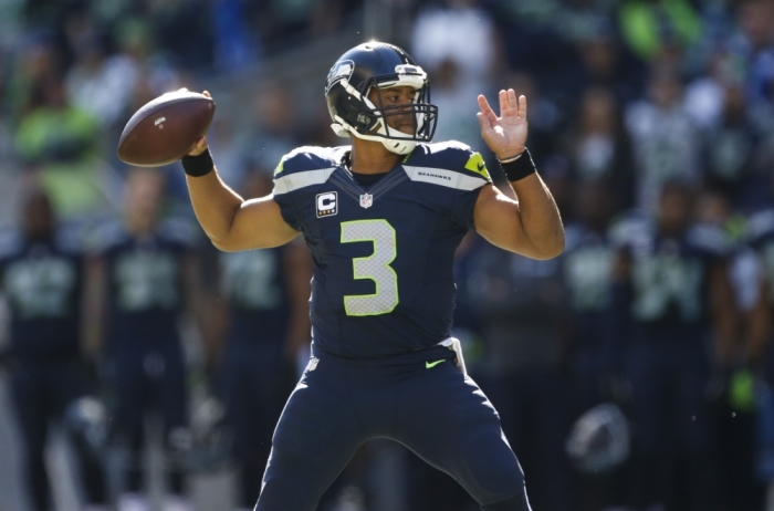 Seattle Seahawks quarterback Russell Wilson (3) passes against the Chicago Bears during the second quarter at CenturyLink Field, Seattle, Washington, on September 27, 2015.